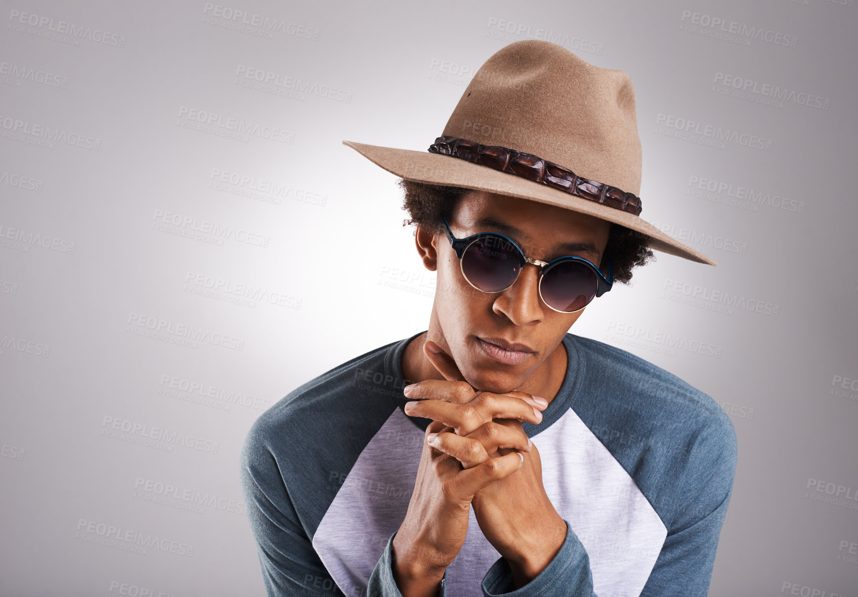 Buy stock photo Fashion, studio and man with sunglasses for summer style, trendy clothes and edgy outfit. Male person, confidence and hat with pose for cool eyewear, face accessory and relax on grey background