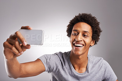 Buy stock photo Selfie, smile and black man with connection, picture and social media on a white studio background. African person, guy and happy model with a smartphone and memory with vlogger, app and video call