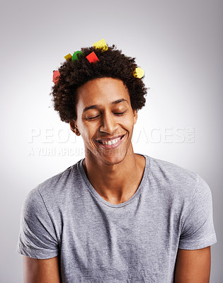 Buy stock photo Smile, afro and black man with hair or confetti, paper and color decoration with happiness isolated on white background. Male person, gen z guy and student with comic hairstyle on studio backdrop