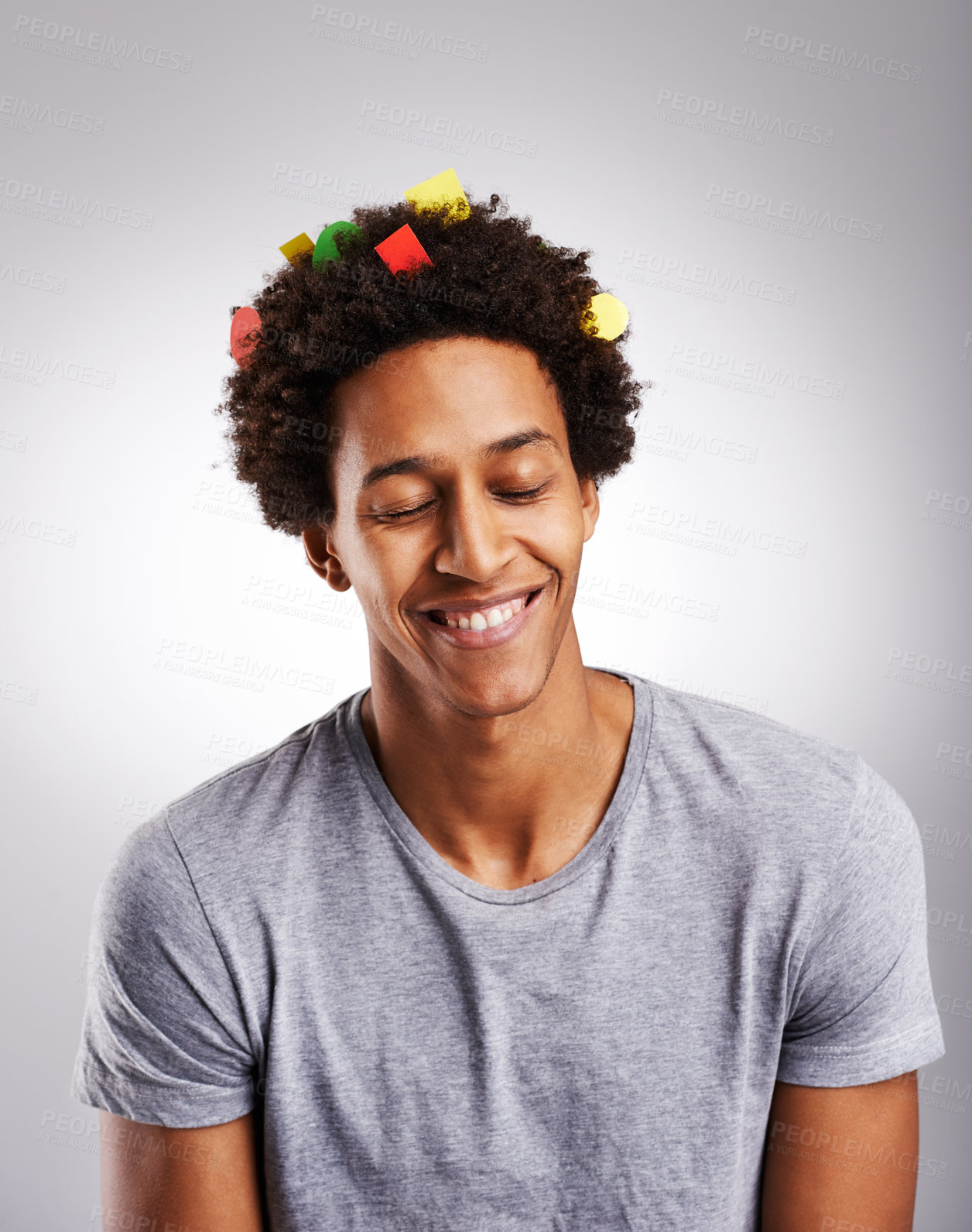 Buy stock photo Smile, afro and black man with hair or confetti, paper and color decoration with happiness isolated on white background. Male person, gen z guy and student with comic hairstyle on studio backdrop