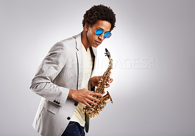 Buy stock photo Saxophone, black man and sunglasses with jazz artist, creative and expression on grey studio background. Person, musician or model with instrument and classic genre with hobby, melody and performance