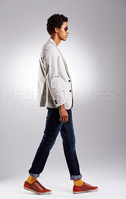 Buy stock photo Studio shot of a fashionable young man against a gray background