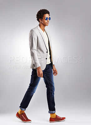Buy stock photo Fashion, suit and cool man in studio with sunglasses, attitude or edgy style decision on grey background. Clothes, aesthetic and male model walking in trendy outfit choice, confident and contemporary