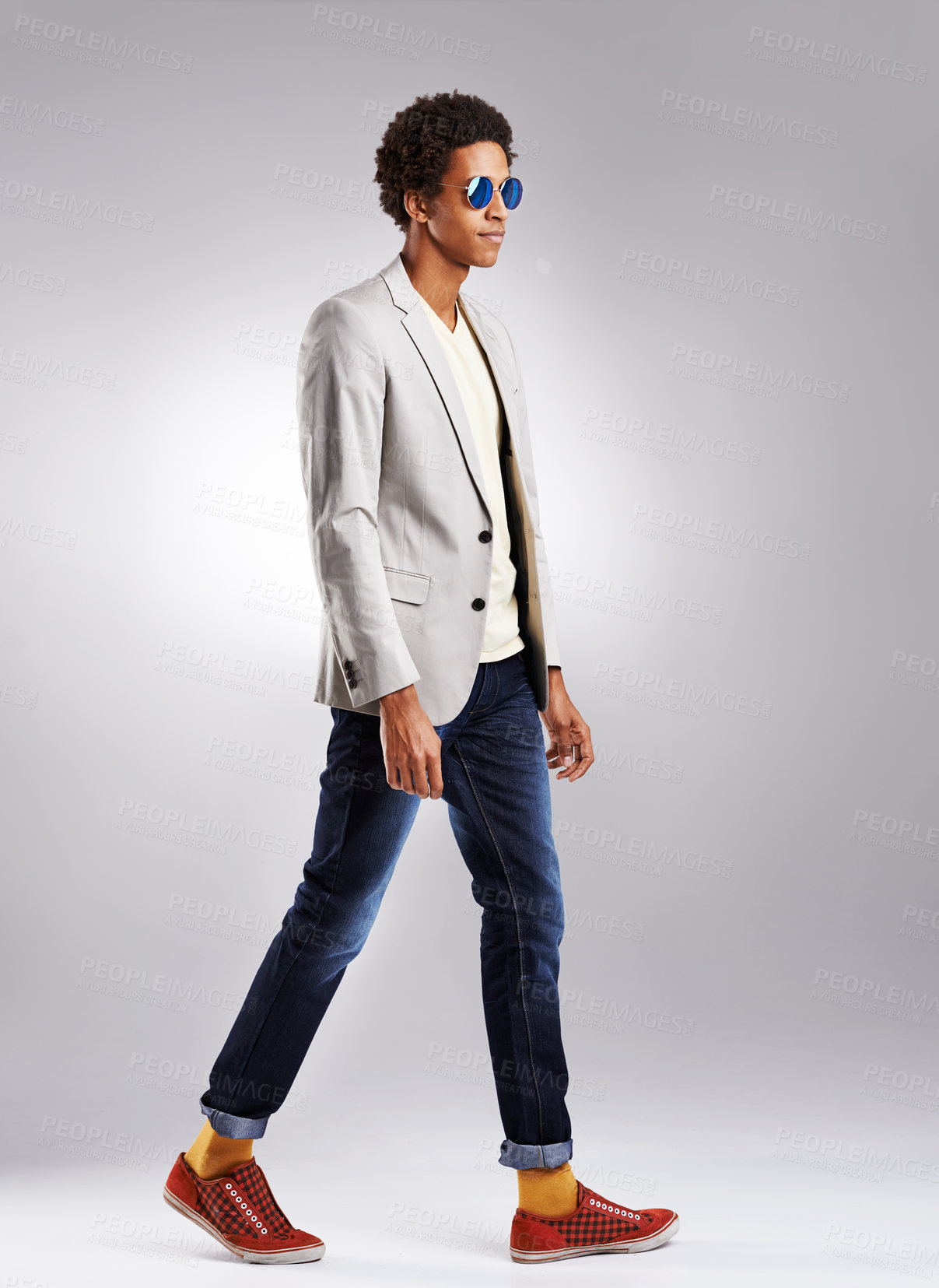 Buy stock photo Fashion, suit and cool man in studio with sunglasses, attitude or edgy style decision on grey background. Clothes, aesthetic and male model walking in trendy outfit choice, confident and contemporary