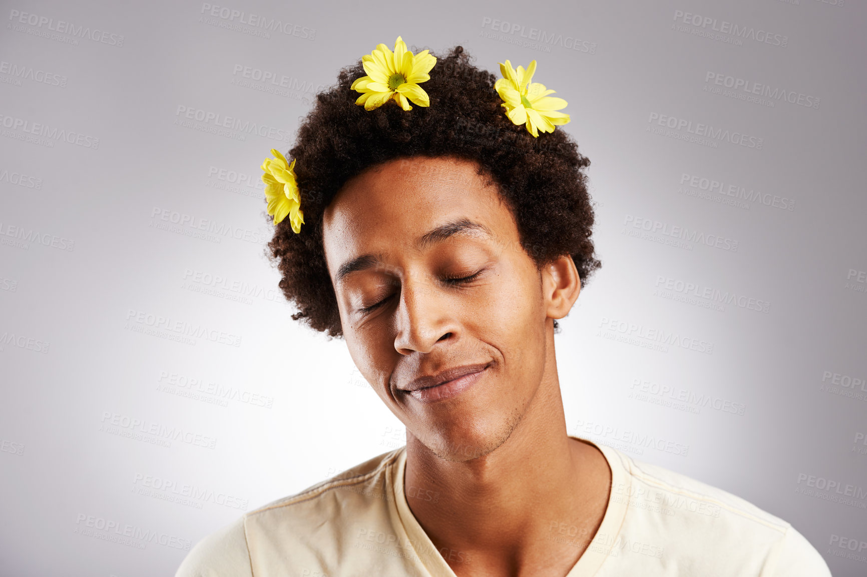 Buy stock photo Eyes closed, natural and black man with hair or flowers, plant and petal decoration or happy isolated on white background. Male person, gen z guy or student with comic hairstyle on studio backdrop
