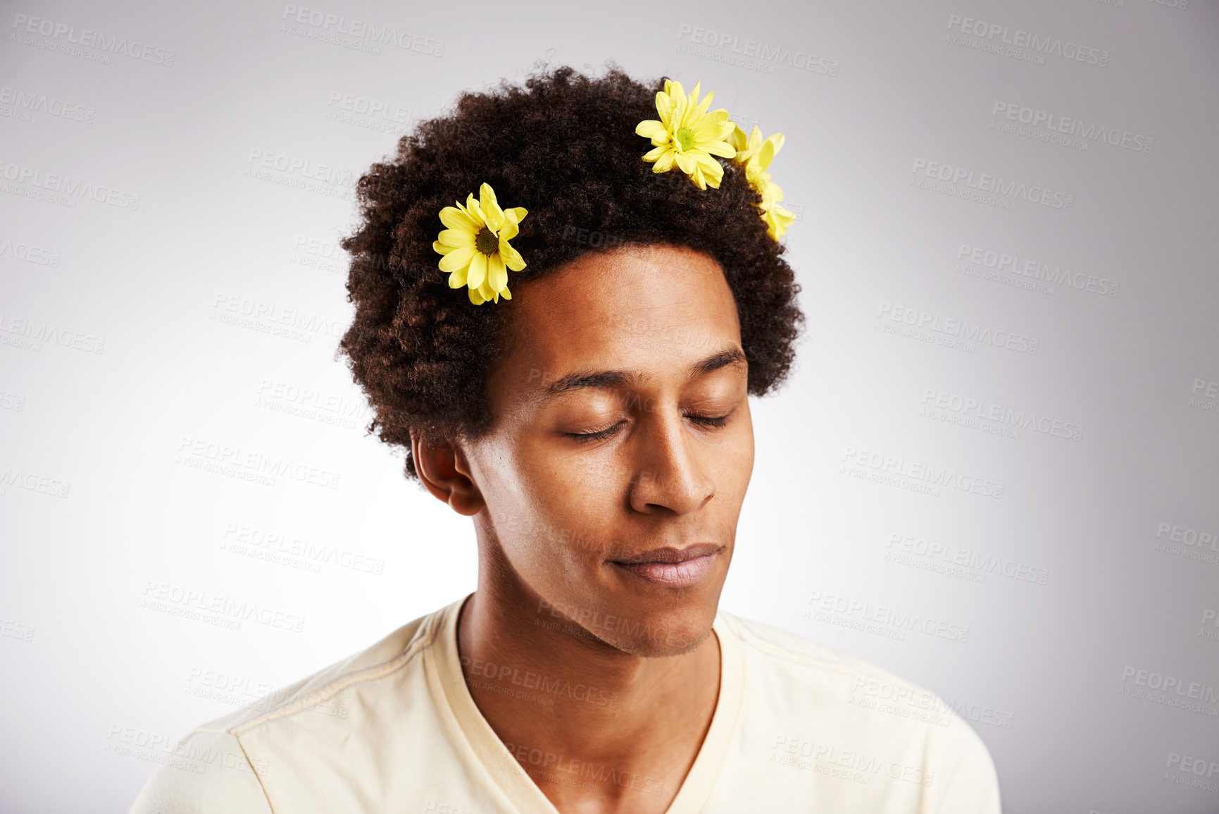 Buy stock photo Eyes closed, black man and natural hair or sunflowers, plant and petal decoration or relax isolated on white background. Male person, gen z guy or student with comic hairstyle on studio backdrop