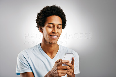 Buy stock photo Black man, typing and college student online with phone to watch meme video or reading comment. Internet, post or person relax with smartphone to scroll on mobile app or share feedback on live stream