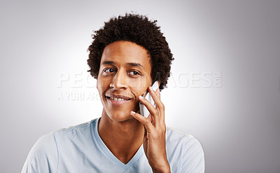 Buy stock photo Phone call, smile and man in studio with mockup for gossip, news or web communication on grey background. Smartphone, listen and African model with networking chat, voice or streaming app connection