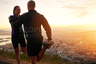 Buy stock photo Sunset, stretching and woman with man for fitness, workout coach and help for healthy body. Exercise, wellness and girl runner with personal trainer in muscle warm up for outdoor training in morning.