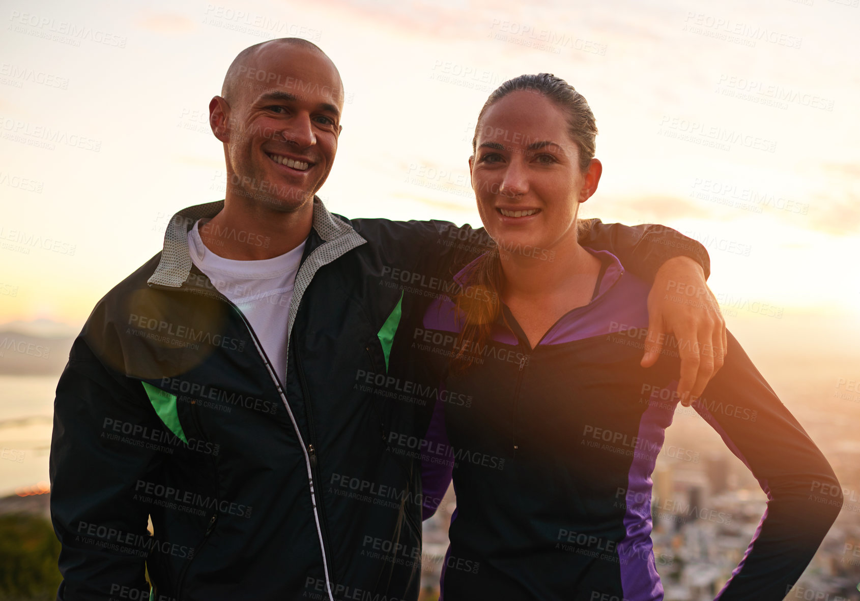 Buy stock photo Happy couple, portrait and fitness with hug in sunset on mountain for workout, exercise or training together. Man and woman with smile, love or support for hiking, running or health and wellness