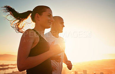 Buy stock photo Sunrise, fitness and happy couple running as workout or morning exercise for health and wellness together. Sport, man and woman runner run with athlete as training in a city for sports with energy