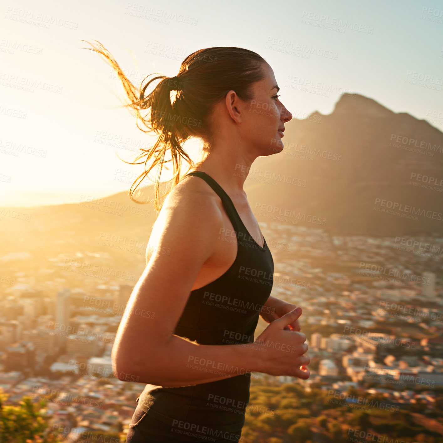 Buy stock photo Fitness, running and woman with sunset in mountain for health, wellness and strong body development. Workout, exercise and girl runner in nature for marathon training, performance and city challenge.