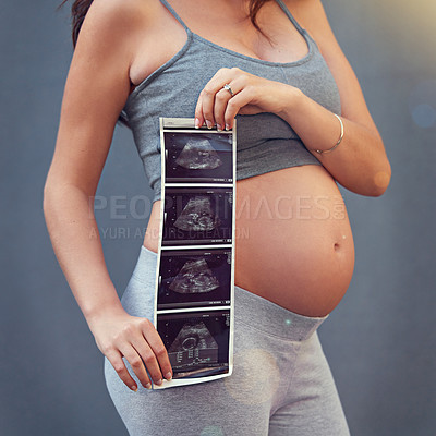 Buy stock photo Mother, pregnancy and ultrasound in studio with belly for gender reveal, album and baby shower. Woman, child and sonogram isolated on gray background for maternity shoot, surrogacy and adoption