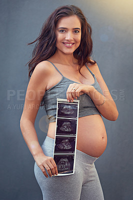 Buy stock photo Mother, pregnant and ultrasound in studio with portrait for maternity shoot, album and baby shower. Woman, body and sonogram isolated on gray background for gender reveal, surrogacy and adoption