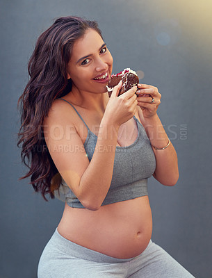 Buy stock photo Pregnant woman, cake and portrait in studio for craving dessert, maternity and prenatal overeating in pregnancy. Mother, smile and belly isolated with sweet confection for  eat, sugar or treats  
