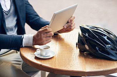 Buy stock photo Businessman, hands and outdoor at cafe with tablet for reading news, article or travel research. Online, communication and cyclist with tech for social media, networking and scroll blog on website