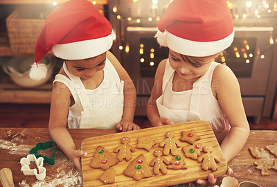 Buy stock photo Kids, cooking and friends with christmas cookies decoration in festive kitchen together with smile. Interracial, baker and happy children with gingerbread cookie tray for holiday celebration.