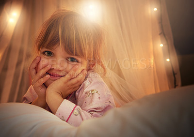 Buy stock photo Bed, lights and portrait of child at night for resting, relaxing and dreaming in home. Happy, smile and face of young girl with fairy light decoration in bedroom for fantasy, magic and childhood