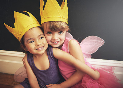 Buy stock photo Children, cute and costumes in portrait with hug for friendship, smile and dress up in fairy clothes for fun. Girls, play and love for diversity, happiness and princess with wings for embracing