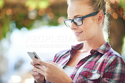 Buy stock photo Woman, reading and online with phone outdoor for communication, social media or mobile chat with smile. Person, glasses or happy with smartphone for text message, internet scroll and email with bokeh