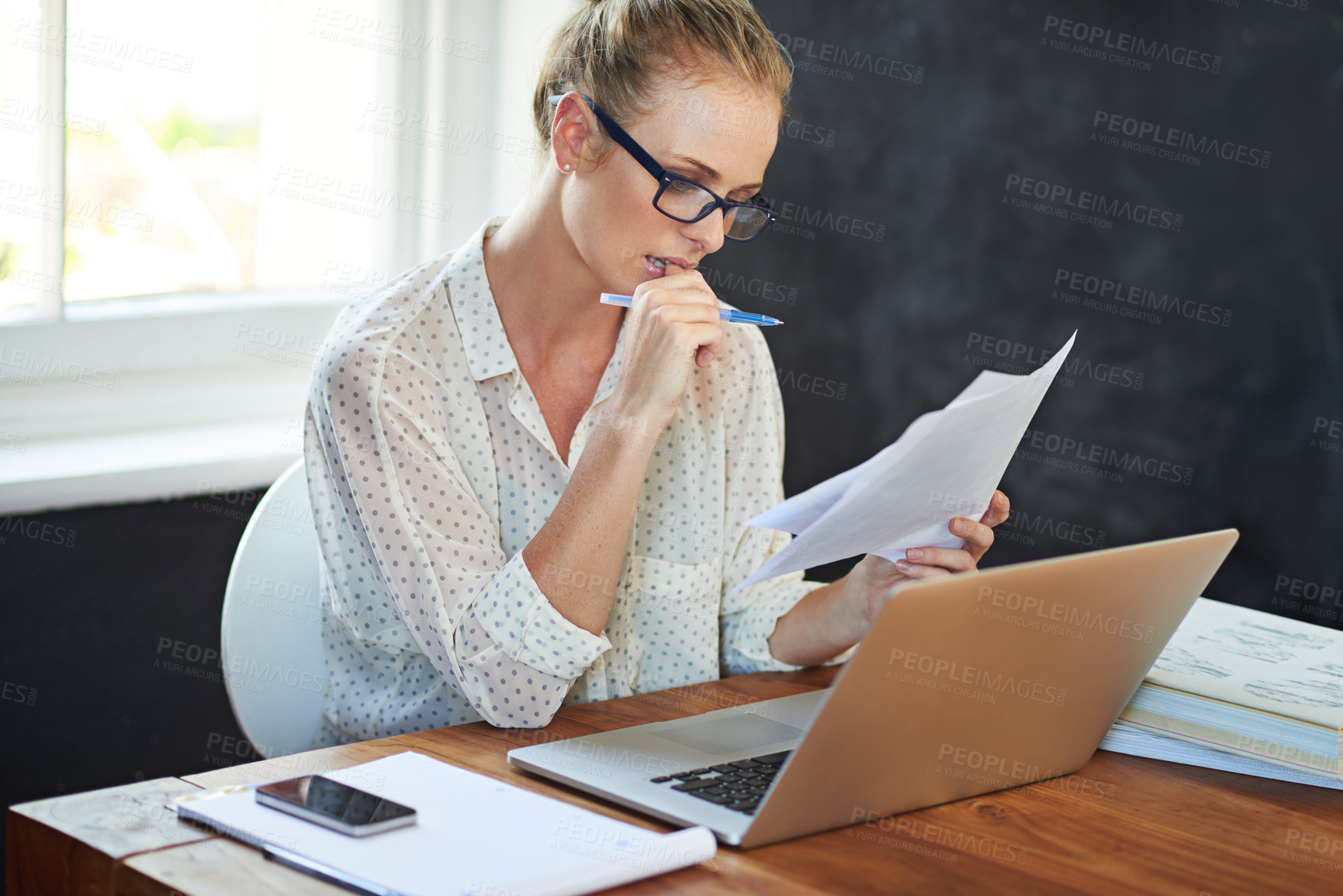 Buy stock photo Shot of a young woman working from home