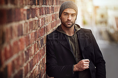 Buy stock photo Man, portrait and winter fashion by brick wall downtown for aesthetic, modern and vacation for city culture. Male person, trendy urban outfit for streetwear style for creative career in New York