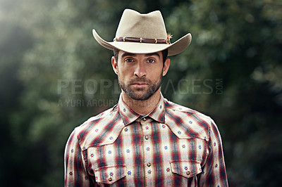 Buy stock photo Man, portrait and outdoor cowboy clothes, western culture and countryside ranch in Texas. Male person, hat and flannel fashion for farmer aesthetic, nature and plaid style by trees or outside bush