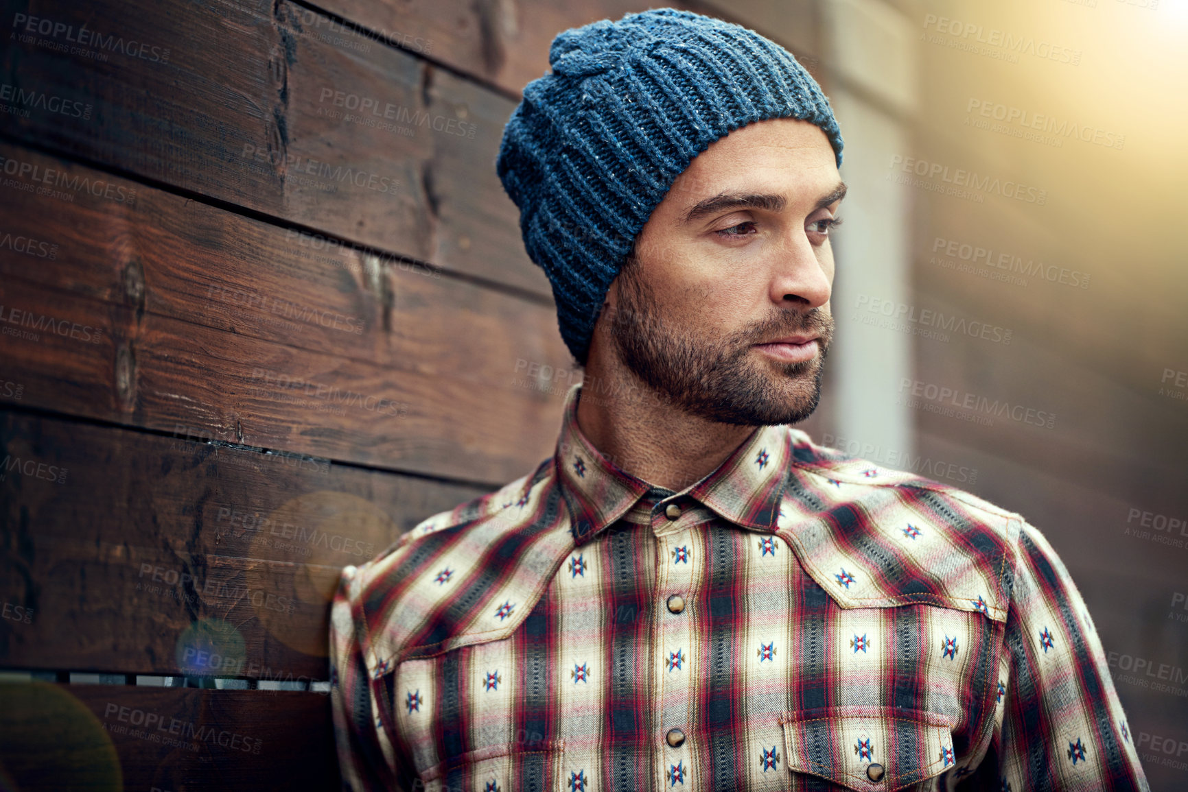 Buy stock photo Fashion, man and thinking on wooden wall with idea for trendy, cool and style for urban outdoor. Male person, choice and planning for weekend or holiday with winter outfit and stylish in Germany