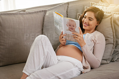 Buy stock photo Happy and pregnant woman, reading baby book at home to prepare for motherhood on sofa. Mother, smile and learning to parent with novel or story for education and research to relax before childbirth