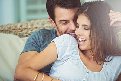 Buy stock photo Happy couple, relax and hug on sofa with laugh for holiday connection in Florida for bonding, resting or marriage. Man, woman and embrace on comfortable couch for together commitment, love or safety