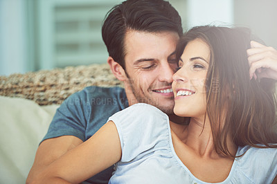 Buy stock photo Happy, love and couple relaxing on sofa for bonding in living room at apartment together. Smile, resting and young man and woman laying on couch for romance and marriage in lounge at modern home.