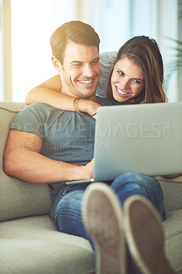 Buy stock photo Laptop, love and woman hugging man on sofa networking on social media, website or internet. Smile, happy and female person embracing husband reading online blog with computer in living room at home.