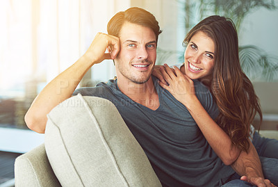 Buy stock photo Happy couple, portrait and relax with hug on sofa for love, care or support together at home. Face of young man and woman with smile for relationship, holiday or weekend in living room at house
