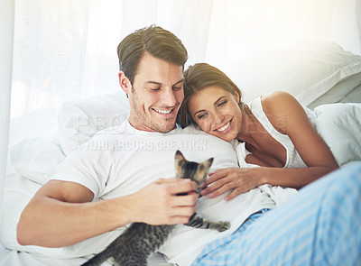 Buy stock photo Bedroom love, pet cat and happy couple relax for morning peace, calm and bonding quality time together in Toronto Canada. Flare, animal kitten and romantic people smile in home bed for Valentines Day