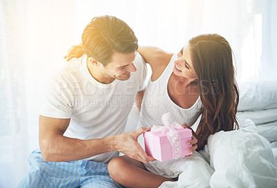 Buy stock photo Man giving woman gift, love and happiness with partnership, relationship and celebration on Valentines day date. Couple smile with present, luxury and commitment, gratitude and celebrate holiday