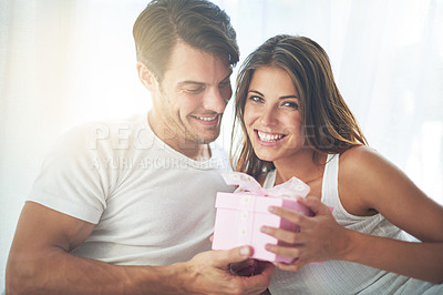 Buy stock photo Couple, gift or present for valentines day portrait celebration with love, care and surprise in bedroom. Man and woman in happy home with box for birthday, holiday or luxury with smile for gratitude