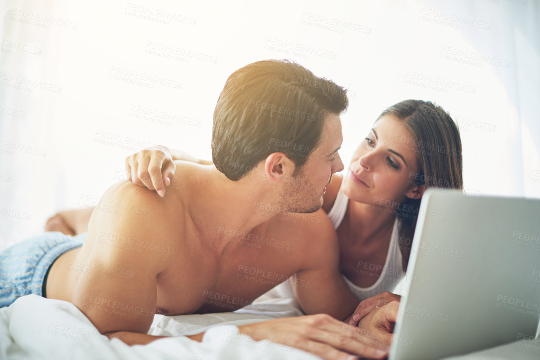 Buy stock photo Couple with laptop, streaming film and relax at home with technology, wifi and happy with chill Valentines day date. Love, commitment and relationship with man and woman in bedroom with subscription