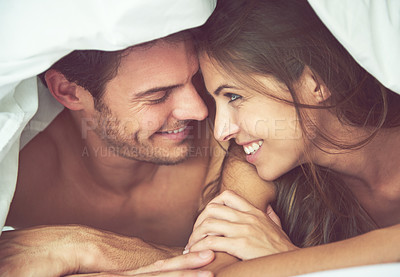 Buy stock photo Couple, happy and love in bed, waking up and bonding in a bedroom together, flirting and romantic. Romance, man and woman relax, intimate and resting at hotel for valentines day, anniversary or bond