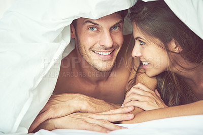 Buy stock photo Couple, portrait and relax in bed, waking up and bonding in a bedroom together, flirting and romantic. Face, man and woman smile, intimate and resting at hotel for valentines day, anniversary or bond