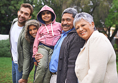 Buy stock photo Portrait, happy and big family together in nature at garden for bonding, relationship or love at backyard. Face, park and child with parents, grandparents and mother with interracial father outdoor