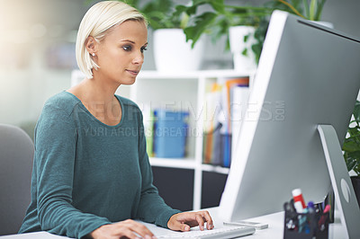 Buy stock photo Shot of a businesswoman working on her office computer