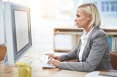 Buy stock photo Shot of a businesswoman working on a desktop computer