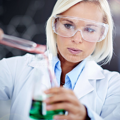 Buy stock photo Shot of a young scientist working in the forensics lab