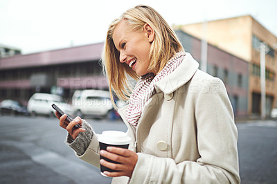Buy stock photo Woman, phone and and coffee in city, winter and texting for scarf, fashion or reading on metro road. Girl, person and happy with smartphone for typing on urban sidewalk by social media in Cape Town