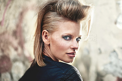 Buy stock photo Woman, portrait and happy in edgy fashion with punk rock hairstyle, attitude and cool in funky clothes by wall. Person, face and leather jacket in urban town, unique and trendy with confidence