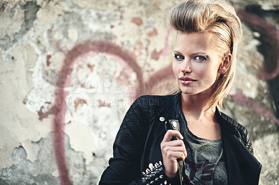 Buy stock photo Woman, portrait or cosmetics in edgy fashion with punk rock hairstyle, attitude or cool in funky clothes by graffiti wall. Artist, face and leather jacket in urban town and trendy style by street art