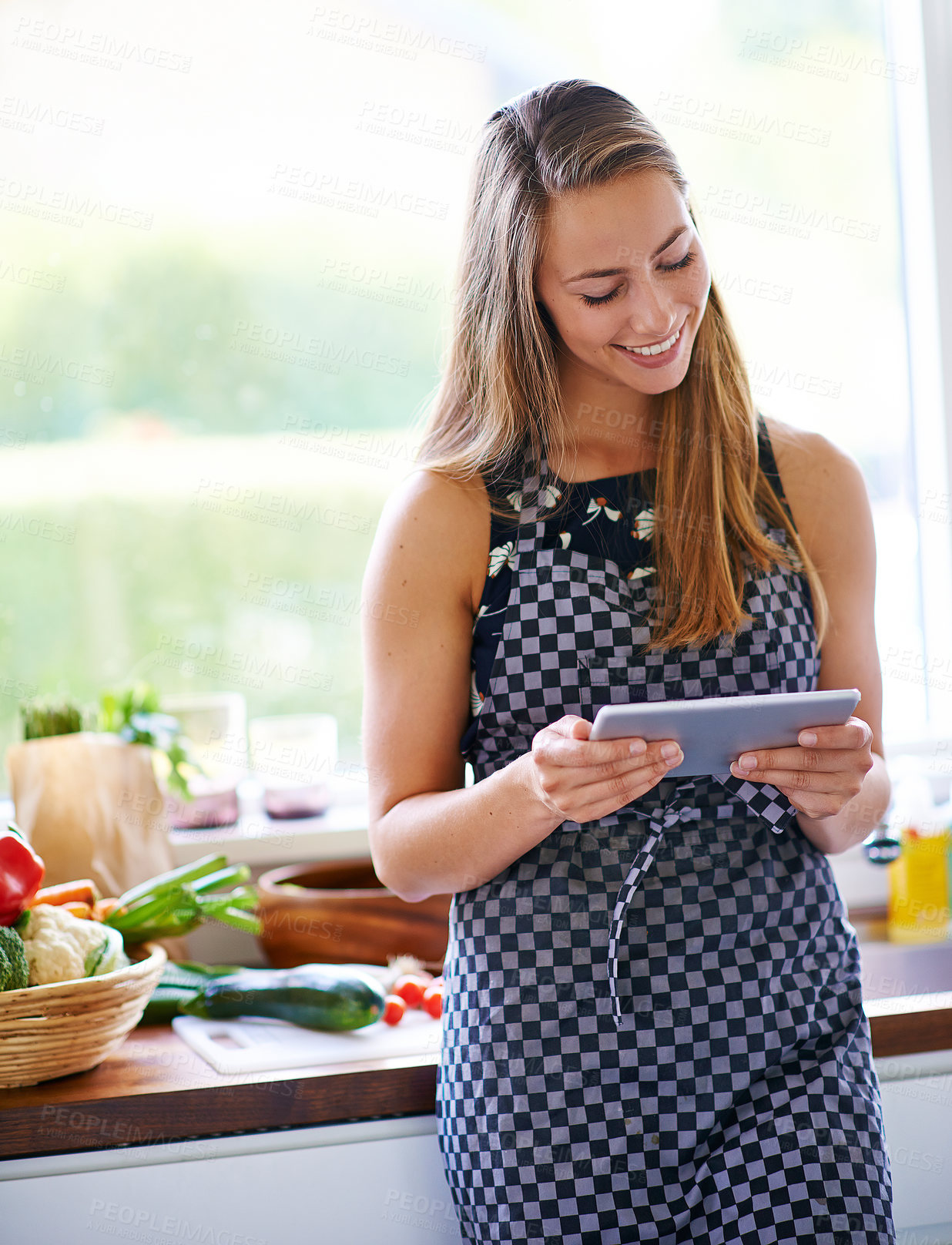 Buy stock photo Cooking, recipe and woman with tablet in kitchen for instructions. healthy lunch or nutrition in home. Connect, food and female person with vegetables for ingredients, search internet or meal prep