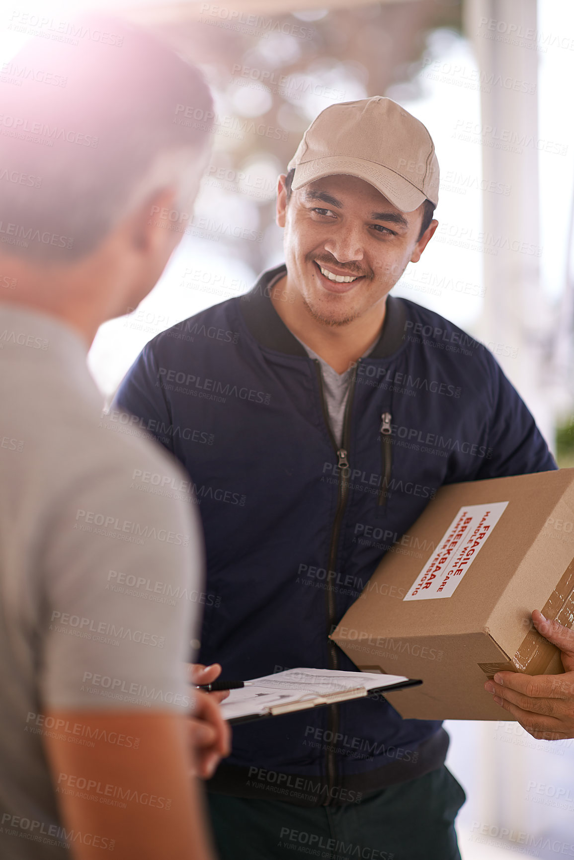 Buy stock photo Courier, delivery and box with customer at front door for online shopping, logistics for ecommerce. Male person, package and paper for signature, distribution or shipping to consumer with happiness