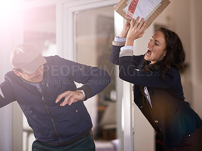 Buy stock photo Cropped shot of a woman reacting angrily toward her delivery man