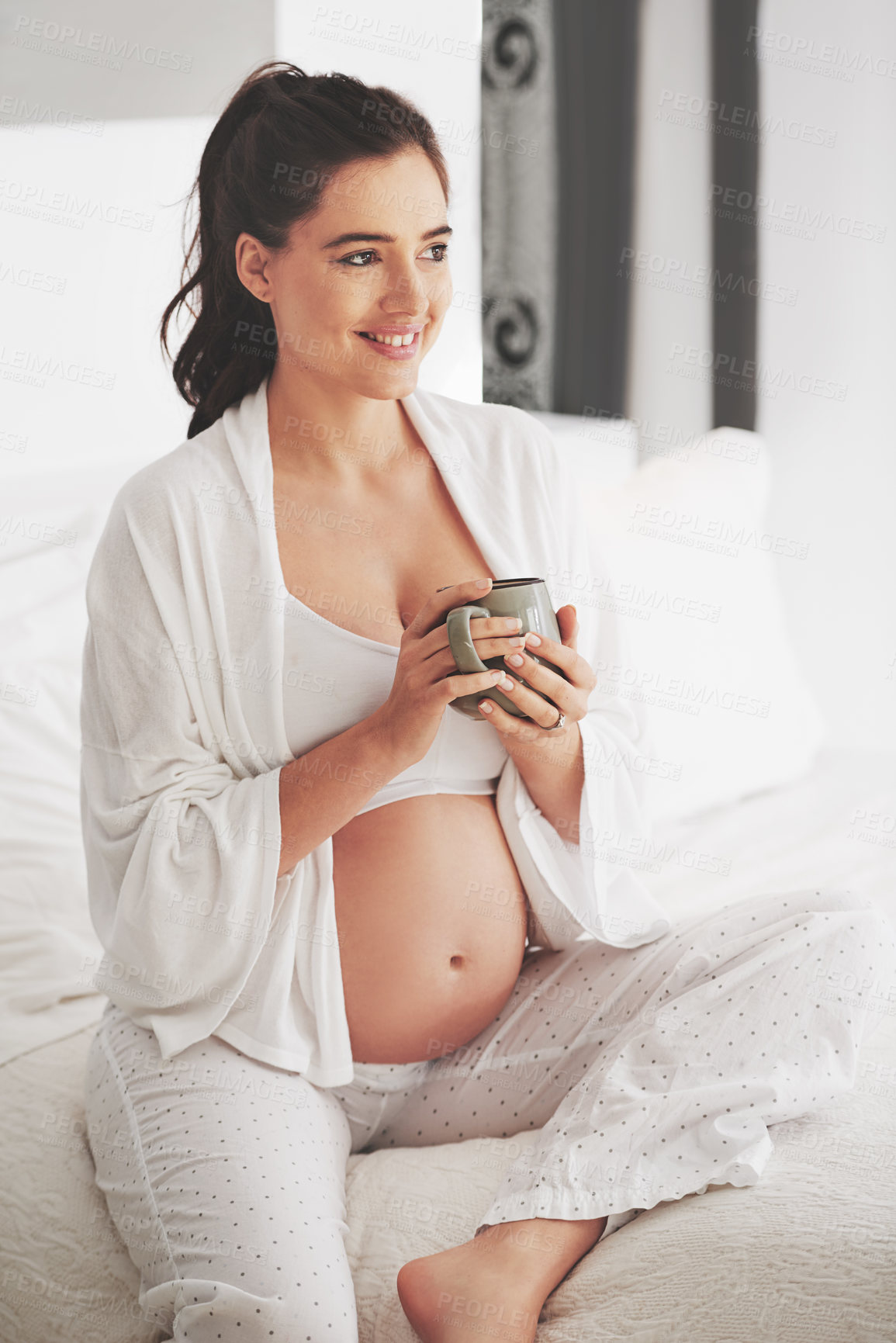 Buy stock photo Pregnant, smile and woman with coffee for energy, drink and nutrition or wellness at home on bed to relax. Mother, stomach or pregnancy on white sheet in bedroom for maternity leave, break or holiday